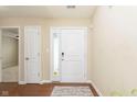 Bright foyer with hardwood floors and a view into the living room at 6467 W Whispering N Way, Greenfield, IN 46140