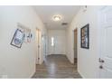 Bright hallway featuring modern flooring and neutral paint, leading to the main areas at 6535 Heben Ct, Indianapolis, IN 46113
