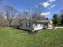 Quaint home with lovely landscaping and blue shutters at 6672 E 225 S, Whitestown, IN 46075