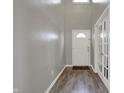 Bright entryway with wood-look flooring and white doors and trim at 7736 Eagle Point Cir, Zionsville, IN 46077