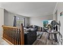 Cozy living room with neutral walls, modern furniture, and a view of the outdoors at 9448 Burrwood Cir, Indianapolis, IN 46235