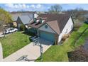 Aerial view of a well-kept home with a nice yard and basketball hoop on a sunny day at 10875 Santa Anita Ct, Carmel, IN 46280