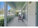 Cozy front porch with seating, perfect for relaxing and enjoying the neighborhood views at 10875 Santa Anita Ct, Carmel, IN 46280