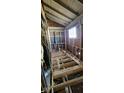 A bathroom is under construction, with plumbing visible and a window providing natural light at 116 N Vine St, Shelbyville, IN 46176