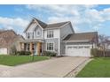 Beautifully designed two-story home featuring a well-manicured lawn, covered porch, and attached garage at 1458 Longleaf St, Avon, IN 46123