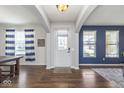 Bright and inviting home entrance with wood floors and contrasting wall colors that add character at 1458 Longleaf St, Avon, IN 46123