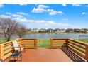 Beautiful backyard deck overlooking a tranquil lake, perfect for relaxation and outdoor living at 2307 Cedarmill Dr, Franklin, IN 46131