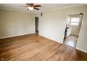 Open-concept living area showcasing hardwood floors and entry to kitchen at 2317 St Peter St, Indianapolis, IN 46203