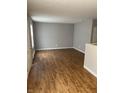 Open living area featuring wood floors, freshly painted walls, and natural light at 2968 N Gale St, Indianapolis, IN 46218