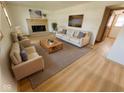 Cozy living room with a brick fireplace and modern decor at 439 Pleasantview Dr, Greenwood, IN 46142