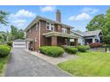 Beautiful brick home with an attached garage and well-maintained landscaping at 4720 Central Ave, Indianapolis, IN 46205