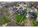 Aerial view of a home showcasing its sprawling yard and neighborhood surroundings at 5202 Logan Ln, Indianapolis, IN 46250