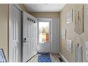 Bright foyer featuring an exterior door with window and view to front yard at 5344 Tincher Rd, Indianapolis, IN 46221