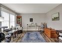 Comfortable living room showcasing a large window, decor accents, rug, and hardwood floors at 594 N Shore Blvd, Franklin, IN 46131