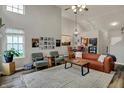 Bright living room with vaulted ceilings, cozy seating, and stylish decor for modern comfort at 6064 Brandermill Rdg, Columbus, IN 47203