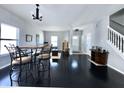 Bright, open living space with hardwood floors, a staircase, and a dining area, creating a welcoming atmosphere at 6518 Sonesta Dr, Indianapolis, IN 46217
