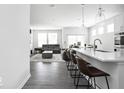 Spacious kitchen with modern appliances and adjacent open-concept living room at 745 Stone Trace Ct, Avon, IN 46123