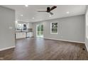 Bright and airy living room featuring hardwood floors, recessed lighting, and a ceiling fan, showcasing an open layout at 7469 Lion Dr, Nineveh, IN 46164