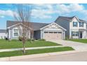 Inviting single-Gathering home boasting a two-car garage, nice curb appeal, and a well-maintained yard at 846 Sunchaser Rd, Lebanon, IN 46052