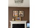 Features a charming fireplace and wall decor at 9851 Pica Dr, Fishers, IN 46040