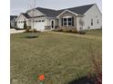 Charming single-story home with a combination of stone and siding and a well-manicured lawn at 99 Gnarled Oak Ln, Whiteland, IN 46184