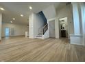 Spacious open-concept living room with modern finishes and stylish lighting at 1038 St Peter St, Indianapolis, IN 46203