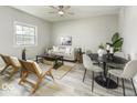 Well-lit living room offering a comfortable seating arrangement and decor for relaxing and entertaining at 126 S 3Rd Ave, Beech Grove, IN 46107