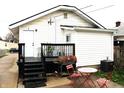 Cozy backyard featuring a deck, patio area with seating, and a grill, perfect for outdoor entertaining at 1311 N Denny St, Indianapolis, IN 46201