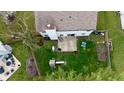Aerial view of the home's backyard featuring a patio and play set at 13993 Whittier Dr, Fishers, IN 46038