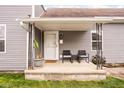 Inviting front porch with seating area, perfect for relaxing and enjoying the neighborhood at 1429 Linden St, Indianapolis, IN 46203
