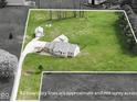 Aerial shot of a property highlighting a spacious lot and separate storage shed at 1873 S 510 E, Franklin, IN 46131