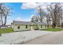 Ranch home with gravel yard and simple landscaping at 2264 Walnut W St, Greenfield, IN 46140