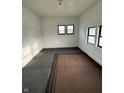 Empty room with carpet flooring, two windows and white walls at 2338 N Harding St, Indianapolis, IN 46208