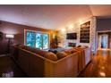 Inviting living room features a stone fireplace, built-in shelving, and sliding glass doors for natural light at 3037 Santiago Dr, Greenwood, IN 46143