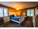 Cozy main bedroom with two windows, white furniture and a ceiling fan at 3037 Santiago Dr, Greenwood, IN 46143