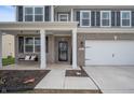Inviting front porch with swing and a well-maintained lawn and landscaping at 315 Limerick Ln, Pendleton, IN 46064