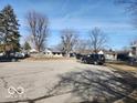 Expansive street view showcasing neighborhood homes and ample parking space available at 3844 Esquire Ct, Indianapolis, IN 46226