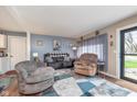 Cozy living room with comfortable seating, stylish rug, and natural light at 516 Hanover Dr, Anderson, IN 46012