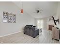Bright living room boasts modern floors, high ceilings, fireplace, and ample natural light at 5541 Fair Ridge Pl, Indianapolis, IN 46221