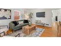 Cozy living room with modern decor, hardwood floors and natural light at 6120 Norwaldo Ave, Indianapolis, IN 46220