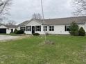 Well-maintained ranch home with a detached garage, set on a green lawn with mature trees at 6431 W 800 S, Pendleton, IN 46064