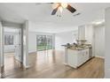 Bright, open living space boasts sleek flooring, a modern kitchen, and sliding glass doors with a view to outside at 7220 Village Parkway Dr # 8, Indianapolis, IN 46254
