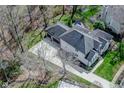 Aerial view of home featuring a spacious driveway and a well-maintained backyard with swimming pool at 7957 Preservation Dr, Indianapolis, IN 46278