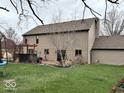 Spacious backyard with a pergola-covered patio and a grassy area, perfect for outdoor entertaining and relaxing at 8212 N Sierra Dr, Muncie, IN 47303