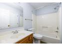 Bathroom with white vanity, updated fixtures, and shower-tub combination with bright lighting at 9029 Crook N Dr, Indianapolis, IN 46256
