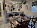 Inviting dining room adjacent to the kitchen with seating and bright light at 1198 Paradise N Way # C, Greenwood, IN 46143