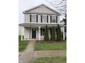 Charming two-story home featuring a welcoming front porch with decorative columns and a well-maintained front yard at 14243 Clapboard Dr, Noblesville, IN 46060