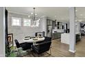 Bright dining area featuring modern light fixture and views of the kitchen at 146 Handley St, Indianapolis, IN 46222