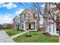A charming two-story home with sidewalk and blue skies at 146 Handley St, Indianapolis, IN 46222