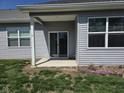 Covered patio featuring a sliding glass door entrance to the home's living space at 1615 Capra Ct, Beech Grove, IN 46107